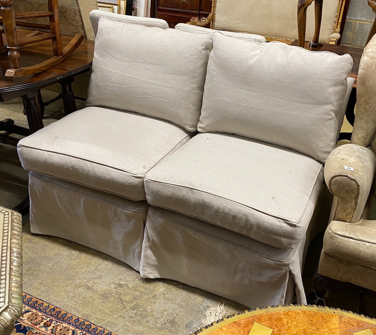 A pair of Oka linen slipper chairs